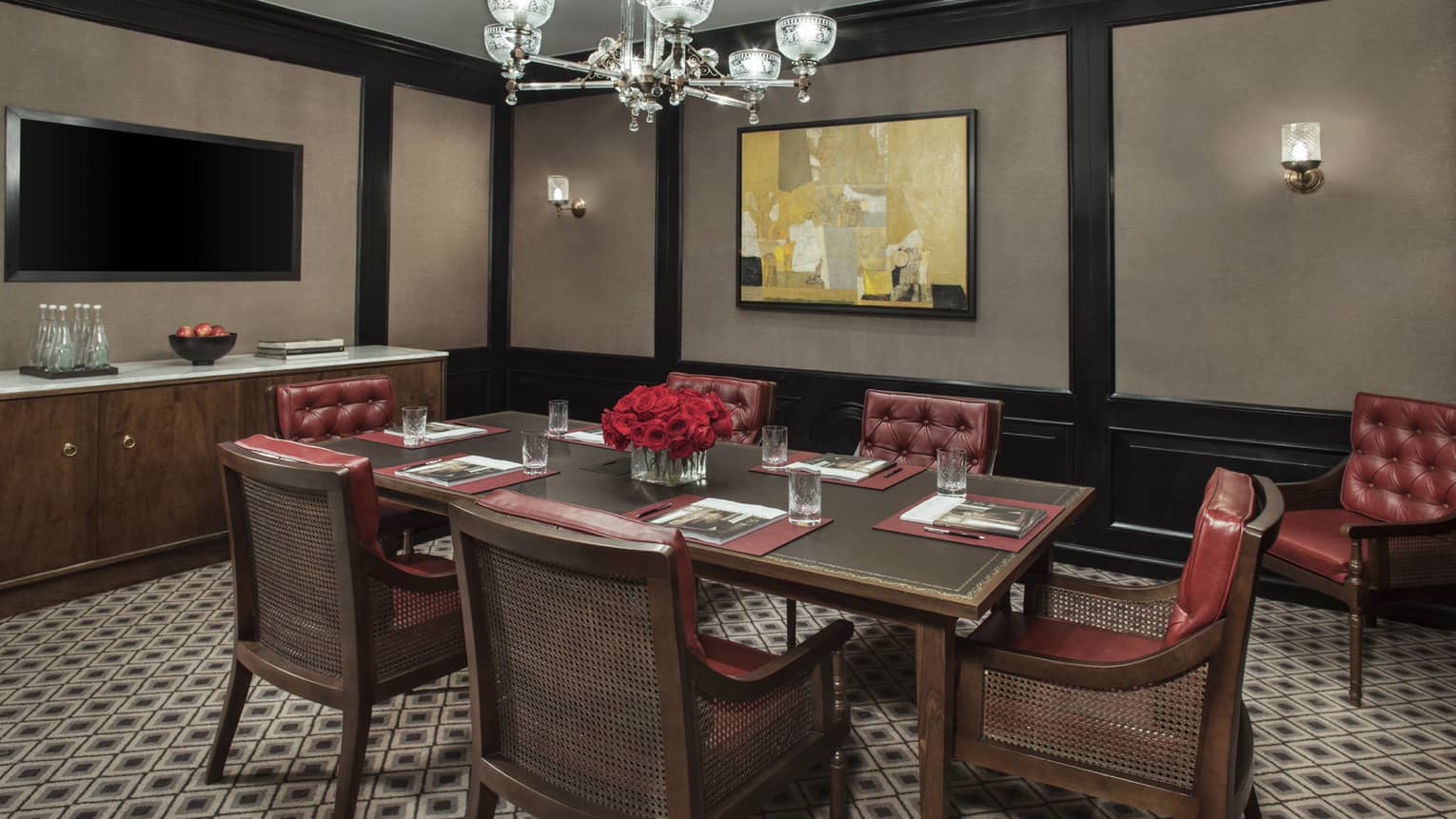 Margot Meeting Room with small boardroom table for six with tufted red leather chairs 