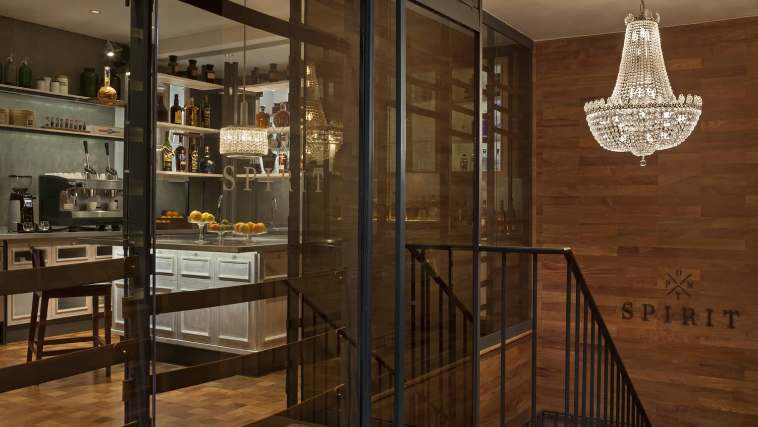 Entrance into a social space / meeting room, which features a small kitchen and lounge seating