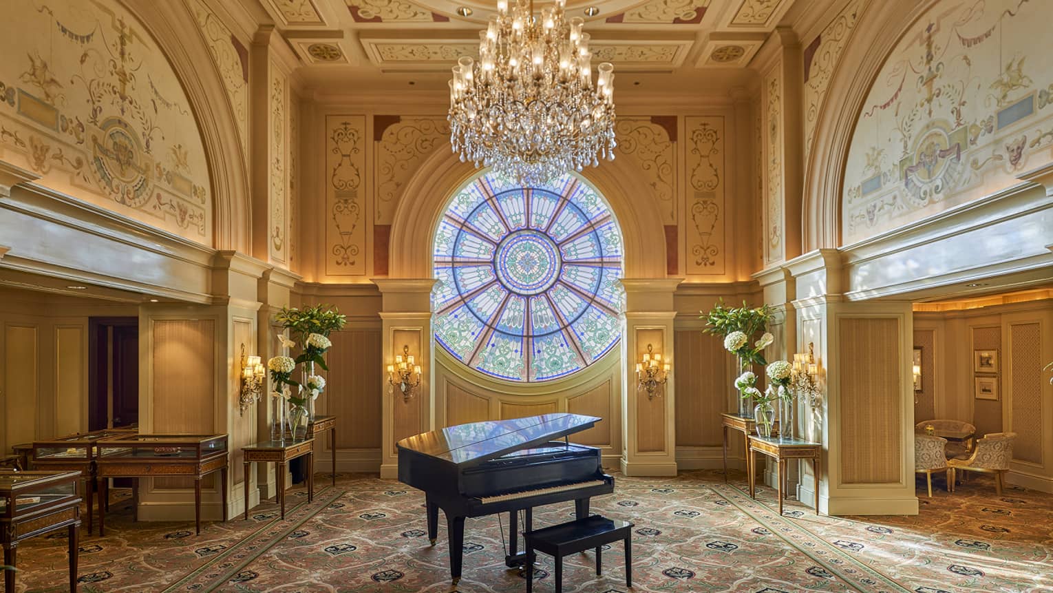 Piano in the Tea Lounge with stained-glass window, the Ocular, in background