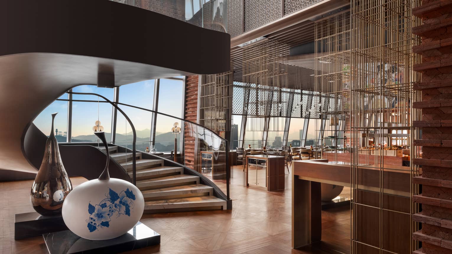 Restaurant at Four Seasons Hotel Dalian, with grand staircase and wall of windows