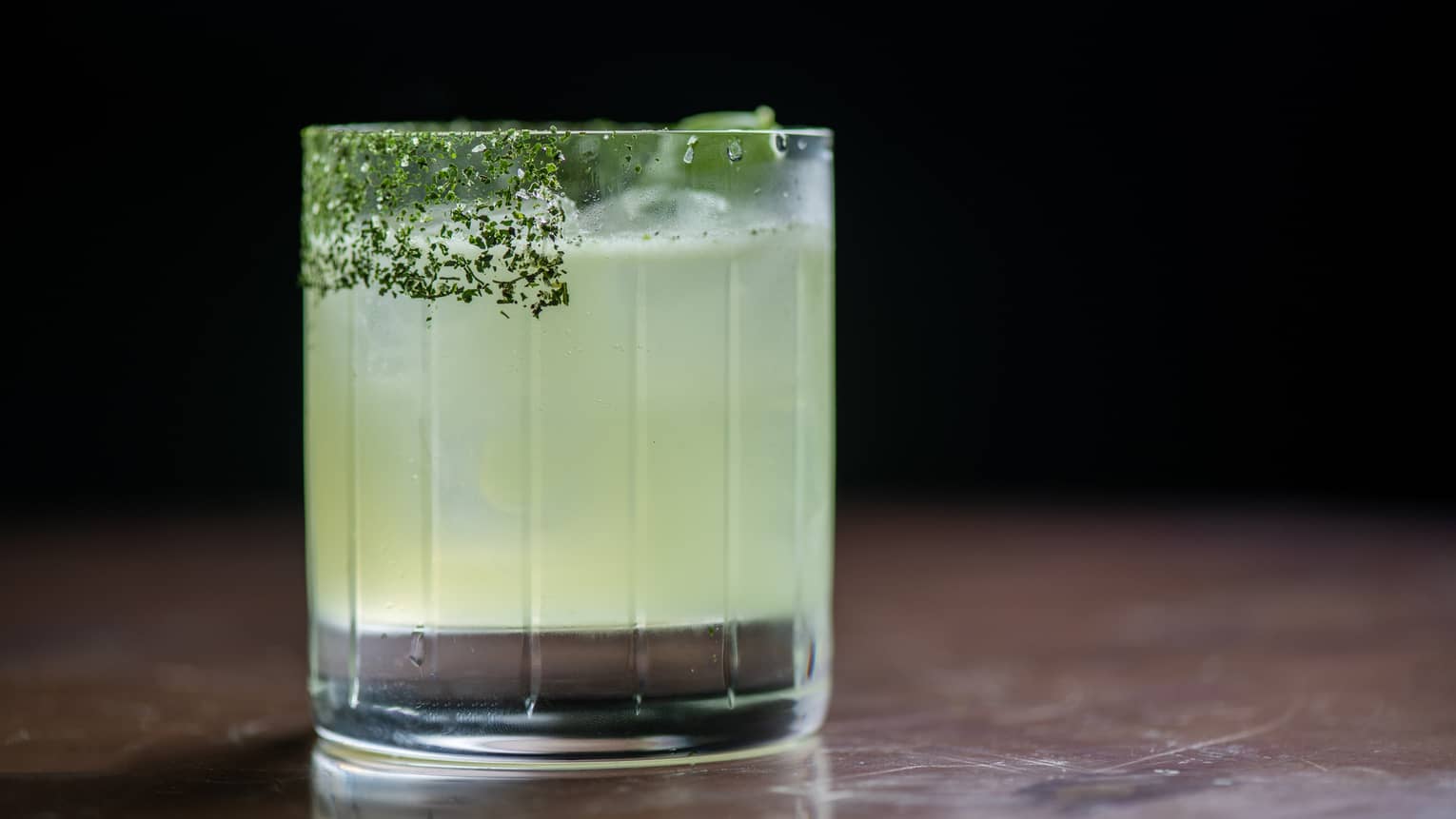 Basil Margarita in a lowball glass with a salt rim