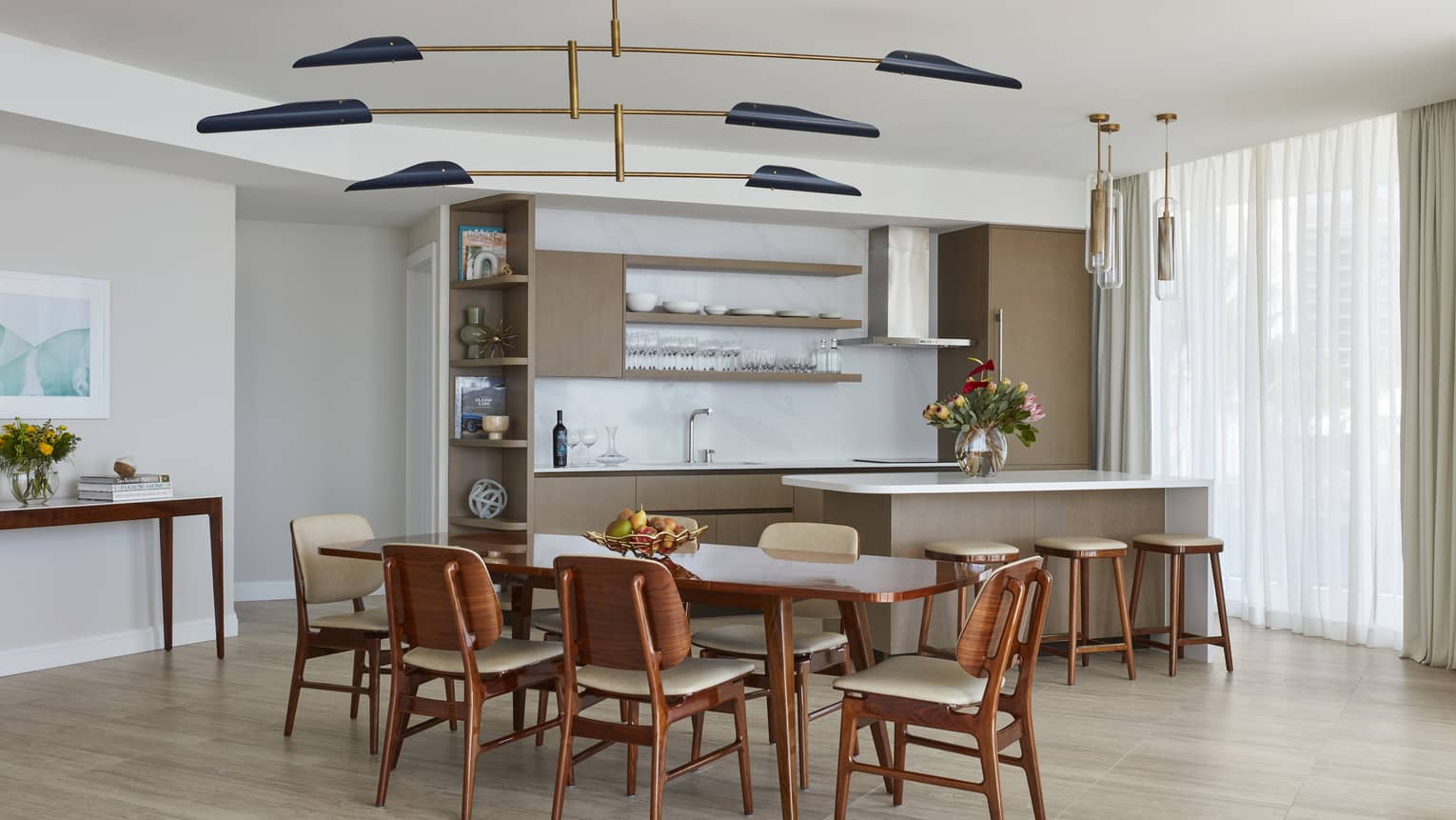 Kitchen and dining table with modern lighting fixture