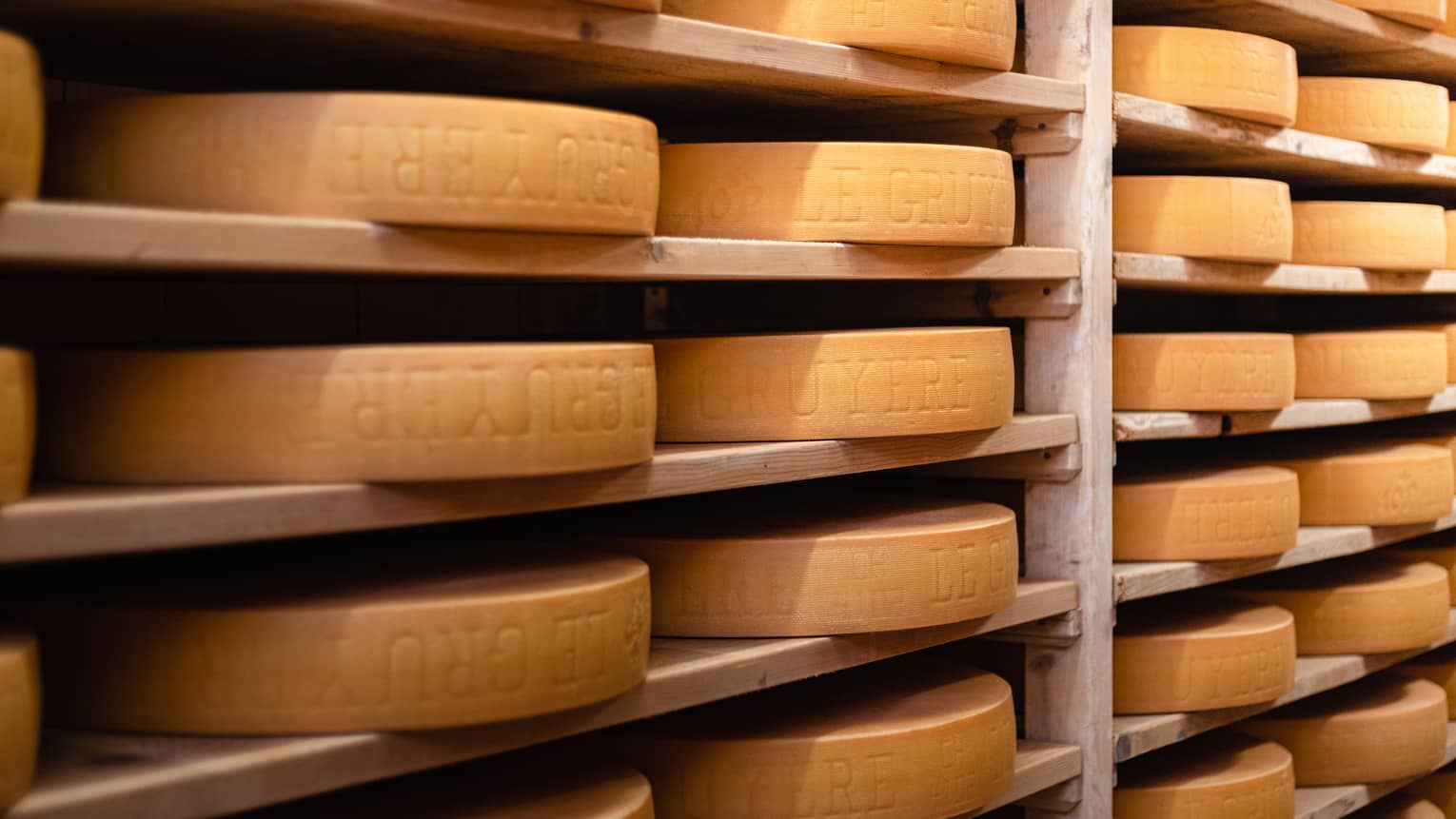 Shelves of Gruy�re cheese wheels