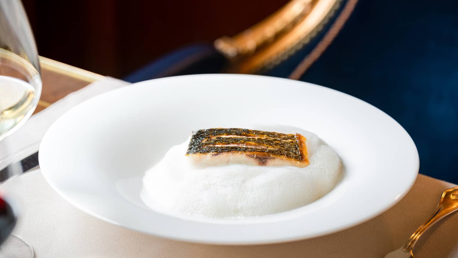 Wild sea bass, roasted artichoke, and lemon emulsion