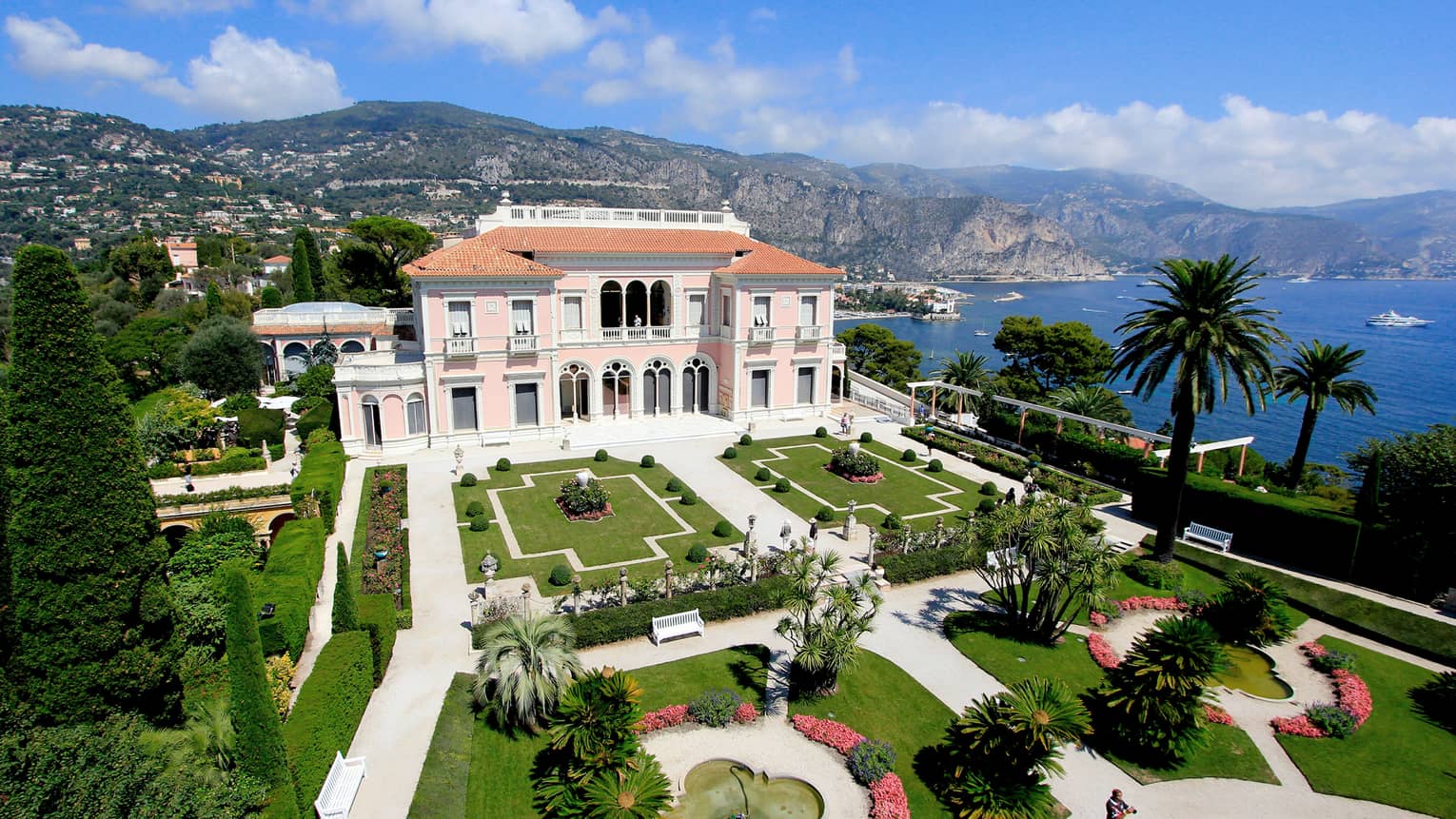 The Grand Hotel, overlooking the water with beautiful arches and pristine gardens 