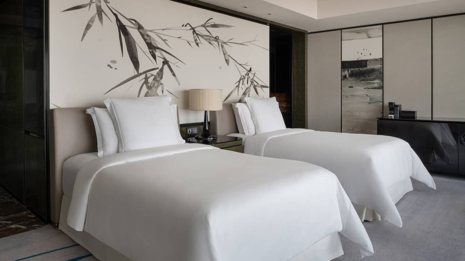 Deluxe Twin River View Room with black and grey accents, bamboo wall art