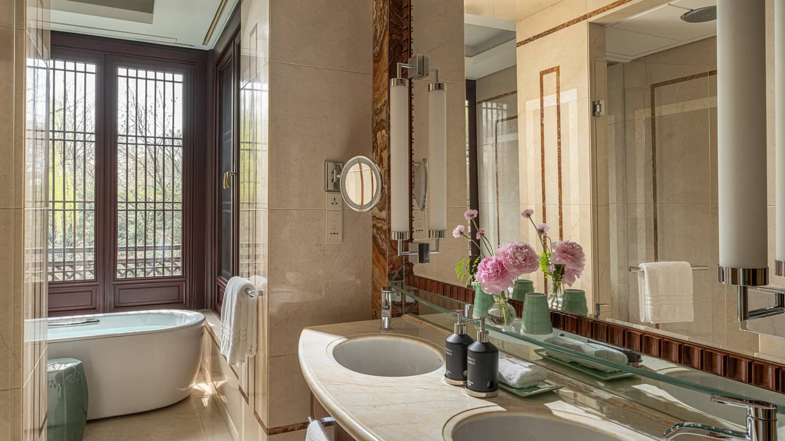 Elegant bathroom with window by tub