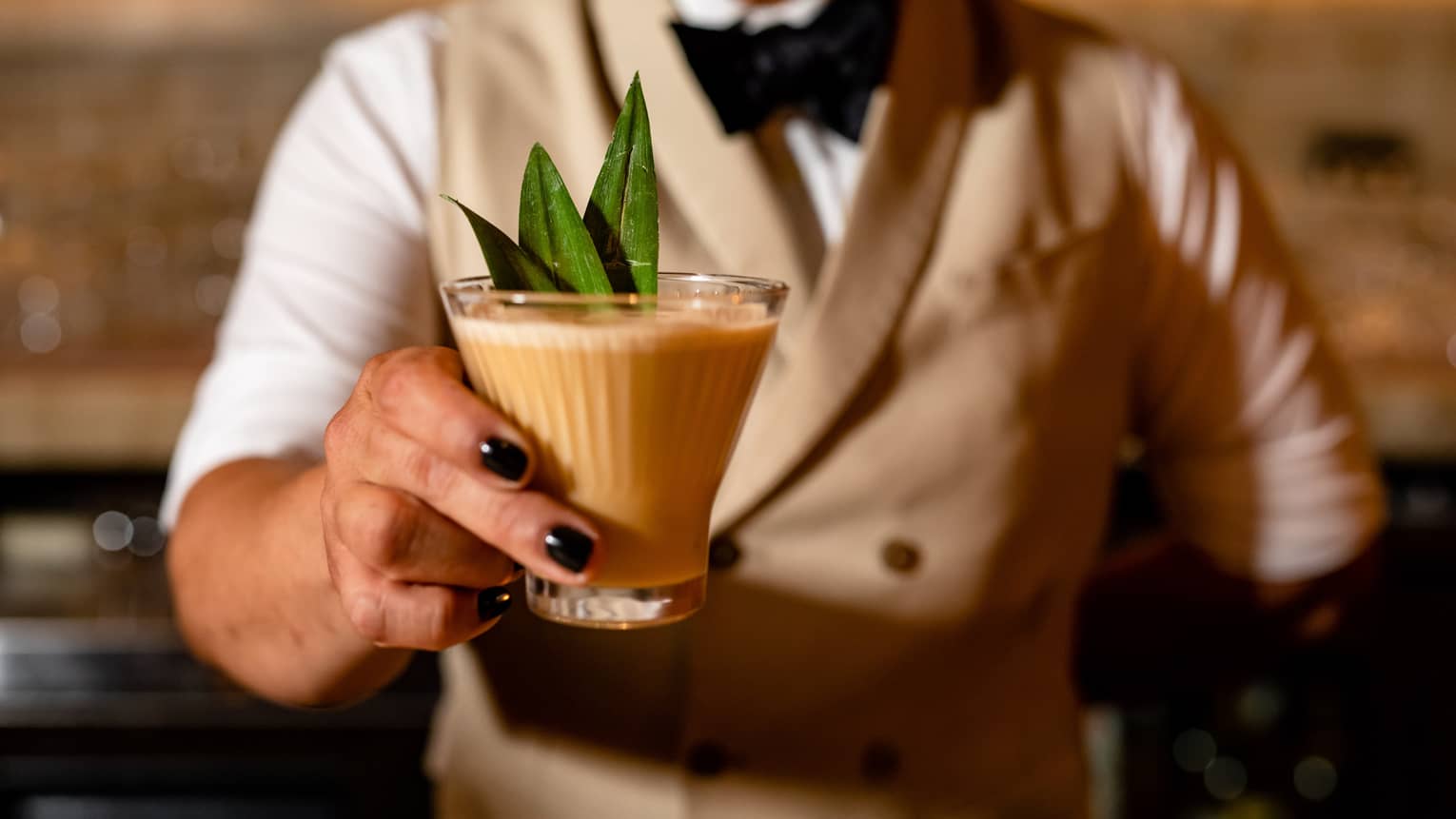 Bartender serving cocktail