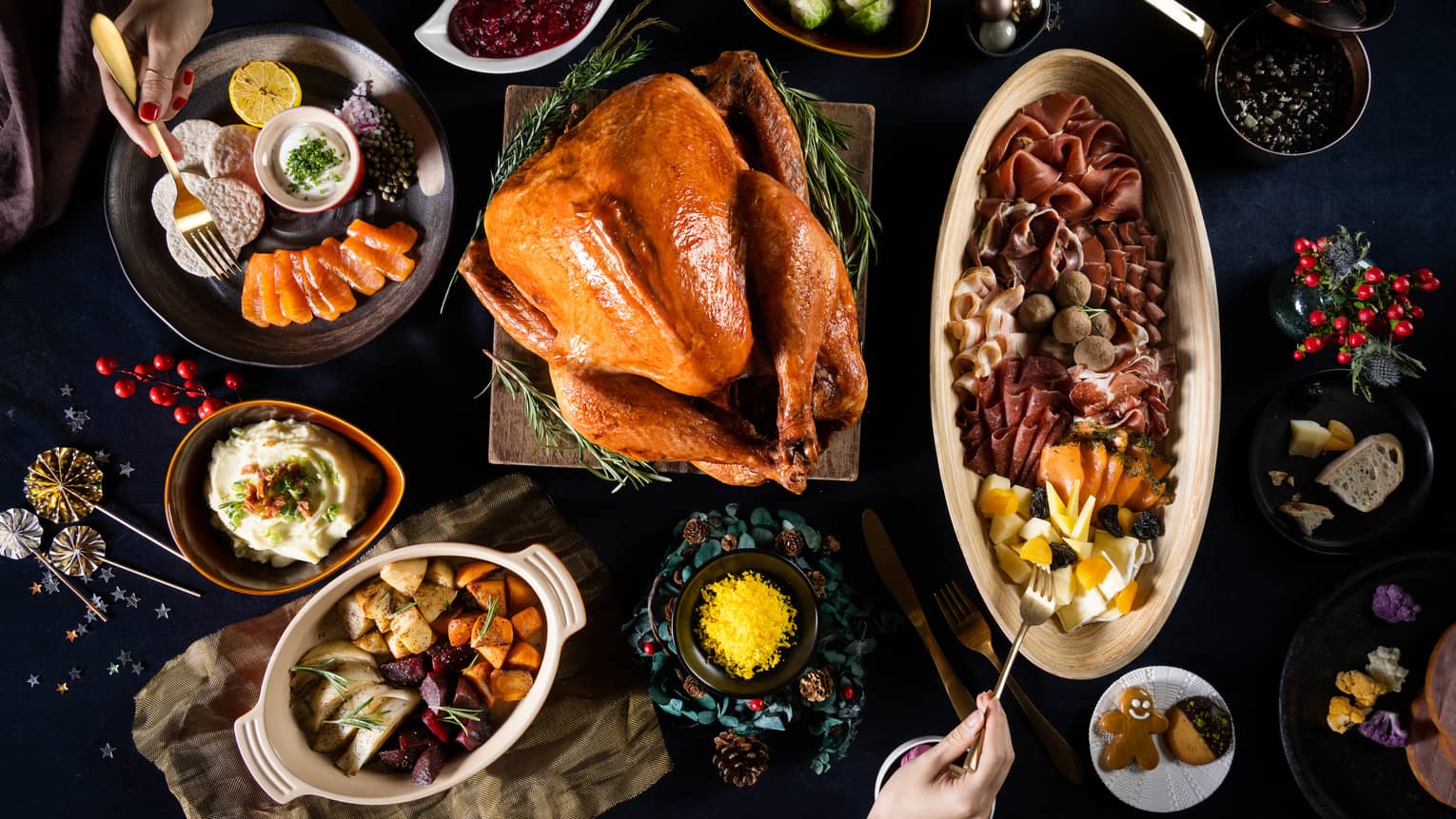 Aerial view of table with roasted turkey and various side dishes