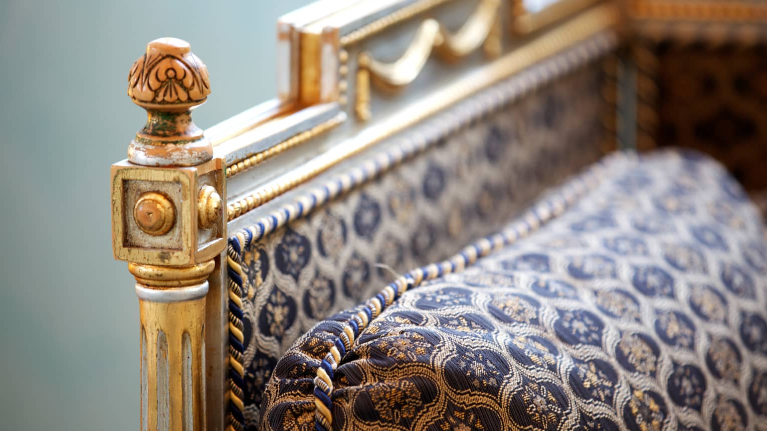Close-up of neoclassical, traditional-style furniture with gold details