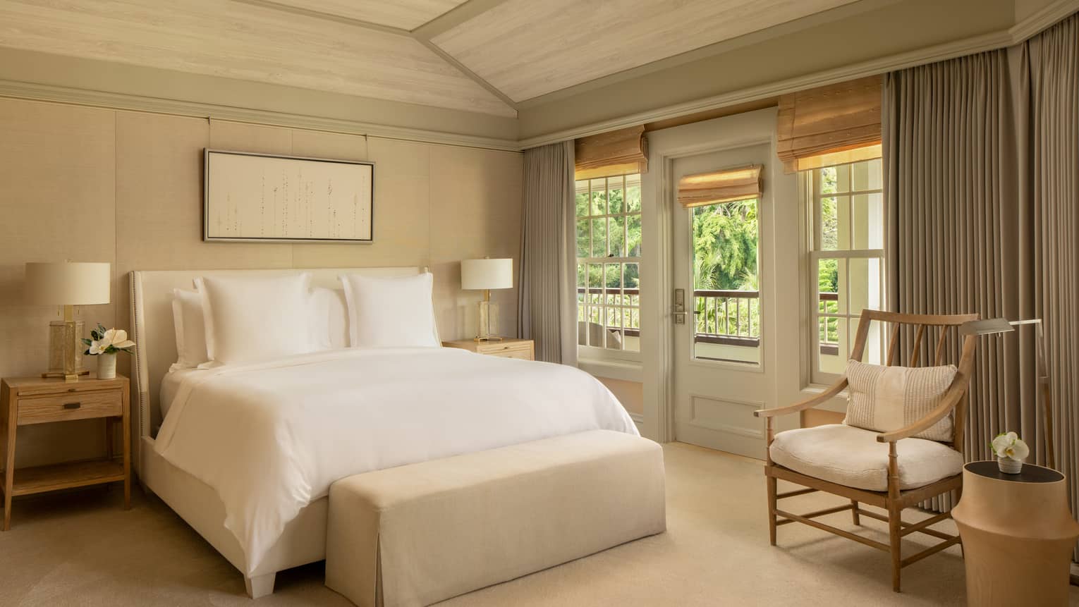 Luxury resort room with plush king bed and garden view
