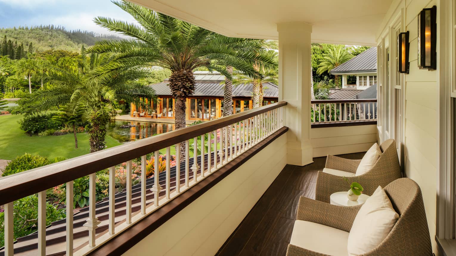 Private lanai of a tropical resort suite, overlooking gardens