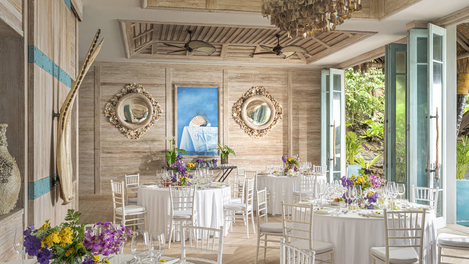 Open-air Beach House set up with banquet tables