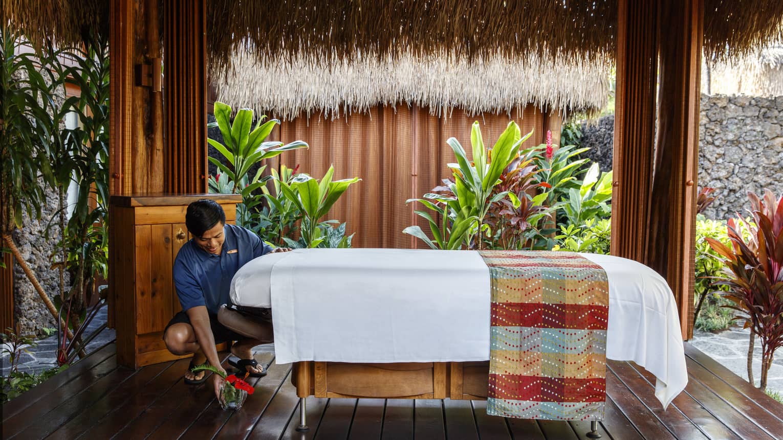 A wellness specialist preparing for a massage
