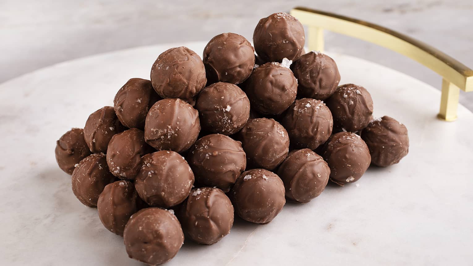 White marble platter stacked with Salty Caramel Truffles