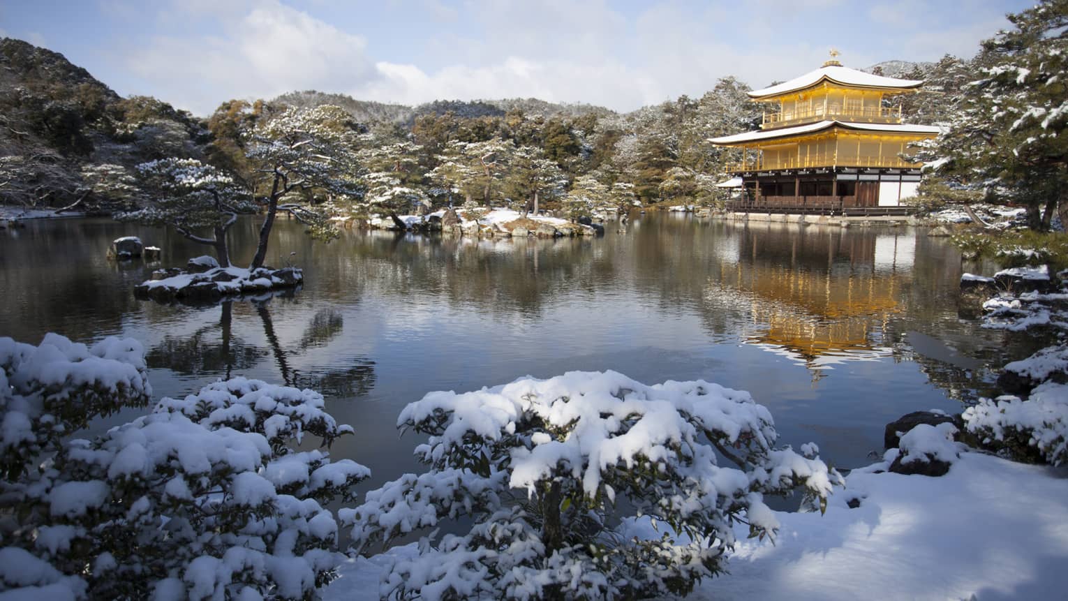 Golden Temple in Kyoto Japan covered with snow by the lake