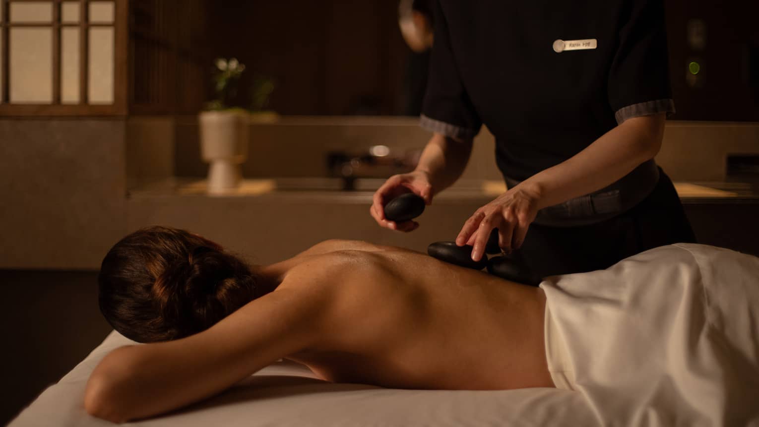 Woman received hot stone treatment
