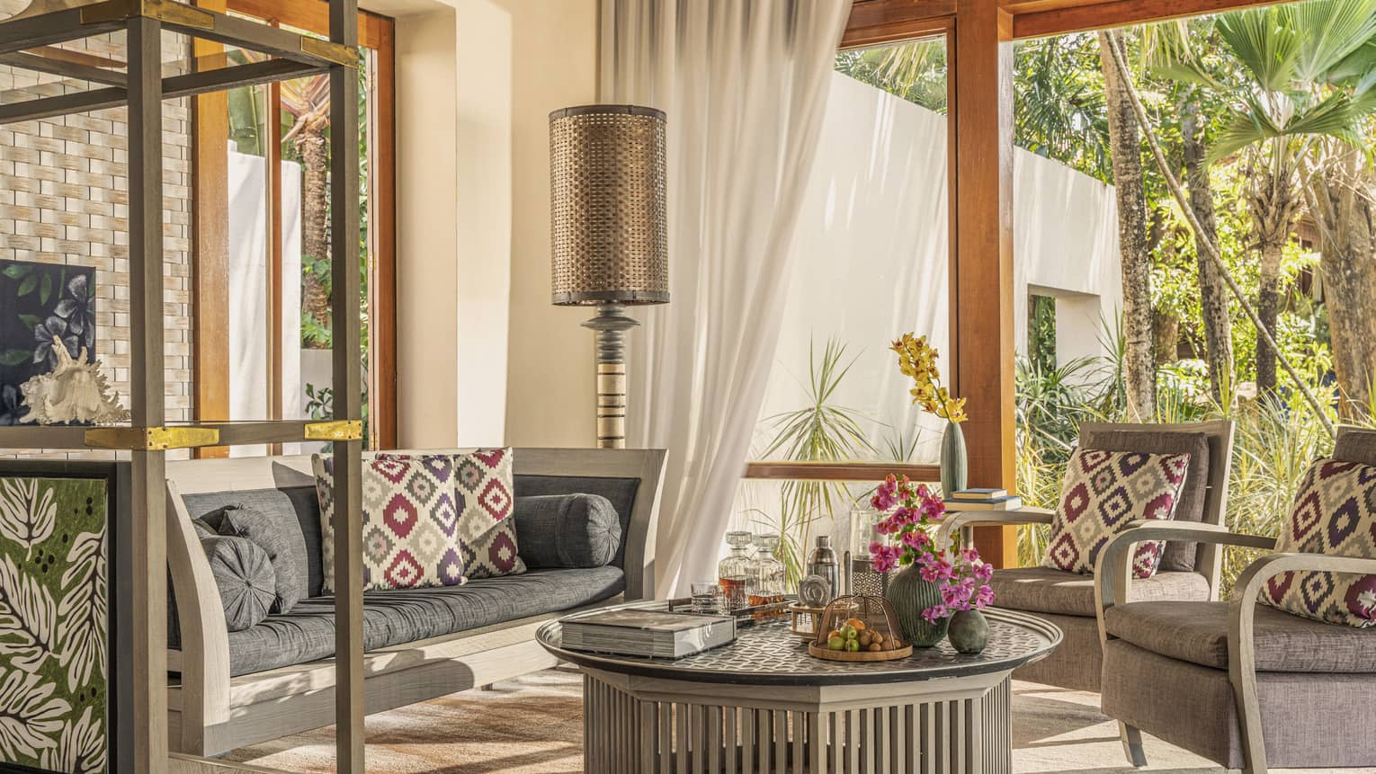 Sitting area with island-inspired interiors and opening to private garden terrace