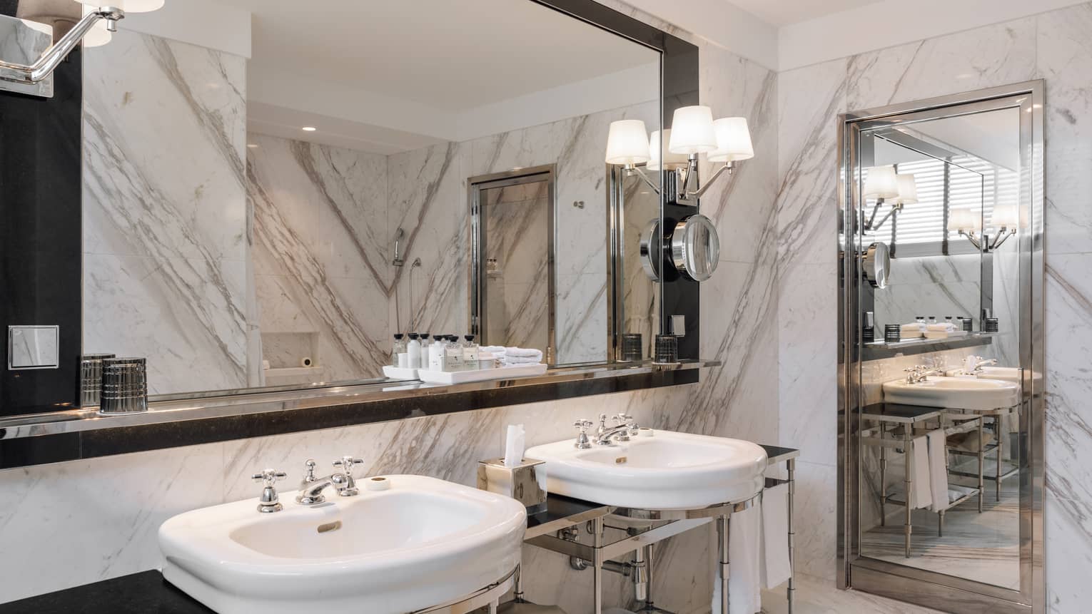 Marble bathroom with two sinks, full-width mirror and a built-in floor-length mirror
