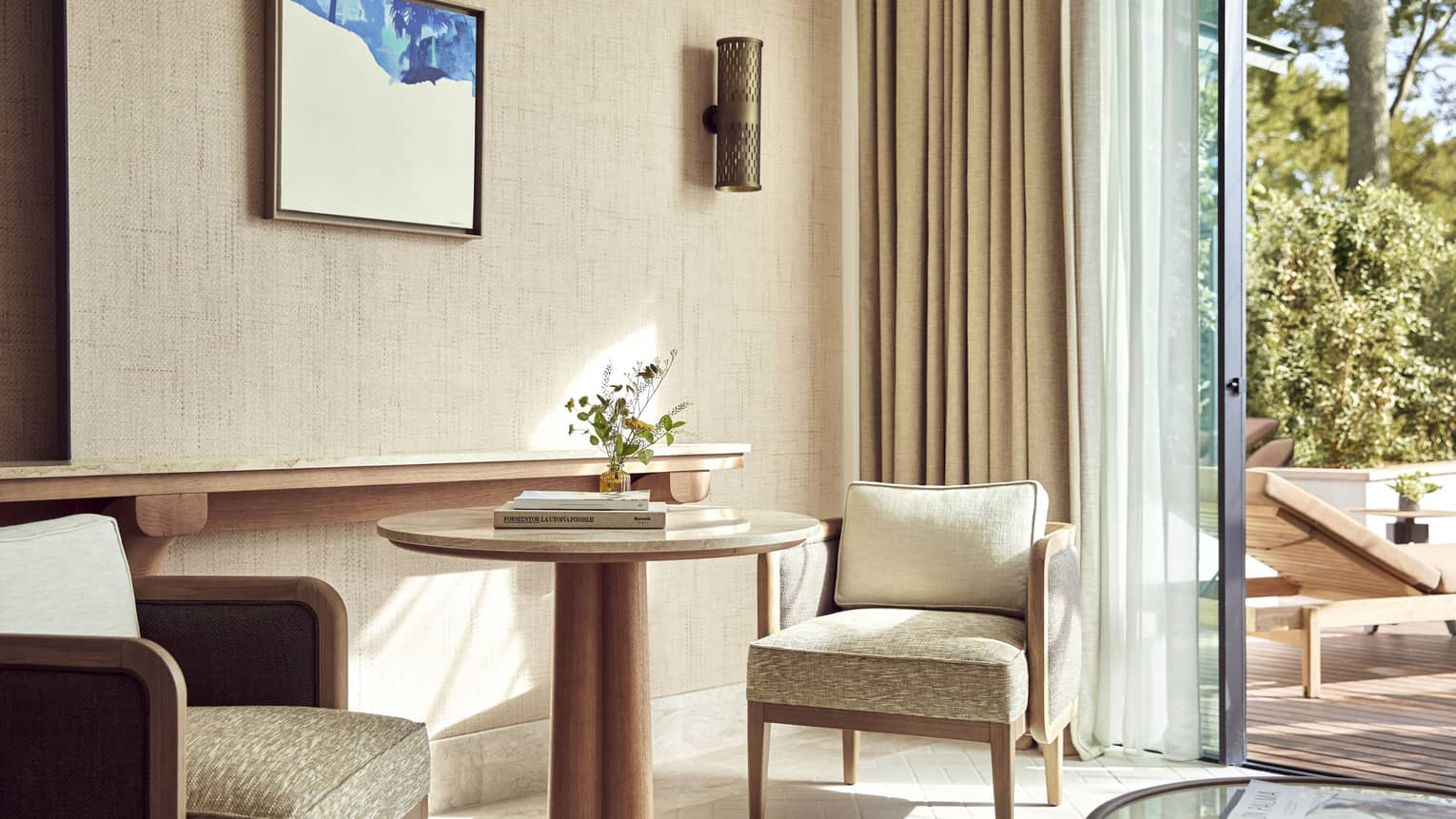 Round table with two chairs in luxury guest room at Four Seasons Resort Mallorca