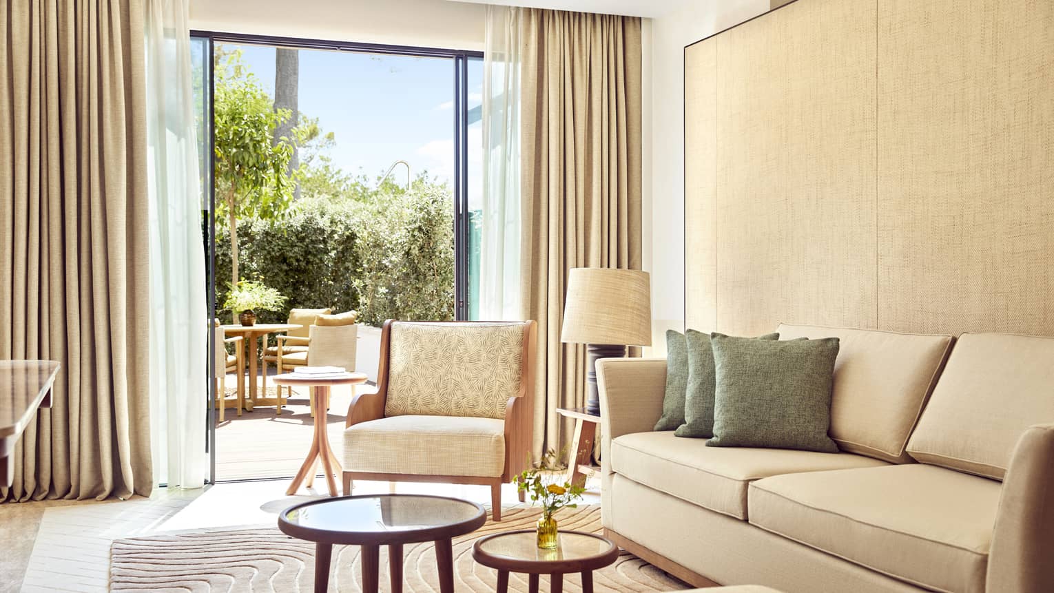 Suite living room with walk-out terrace at Four Seasons Resort Mallorca