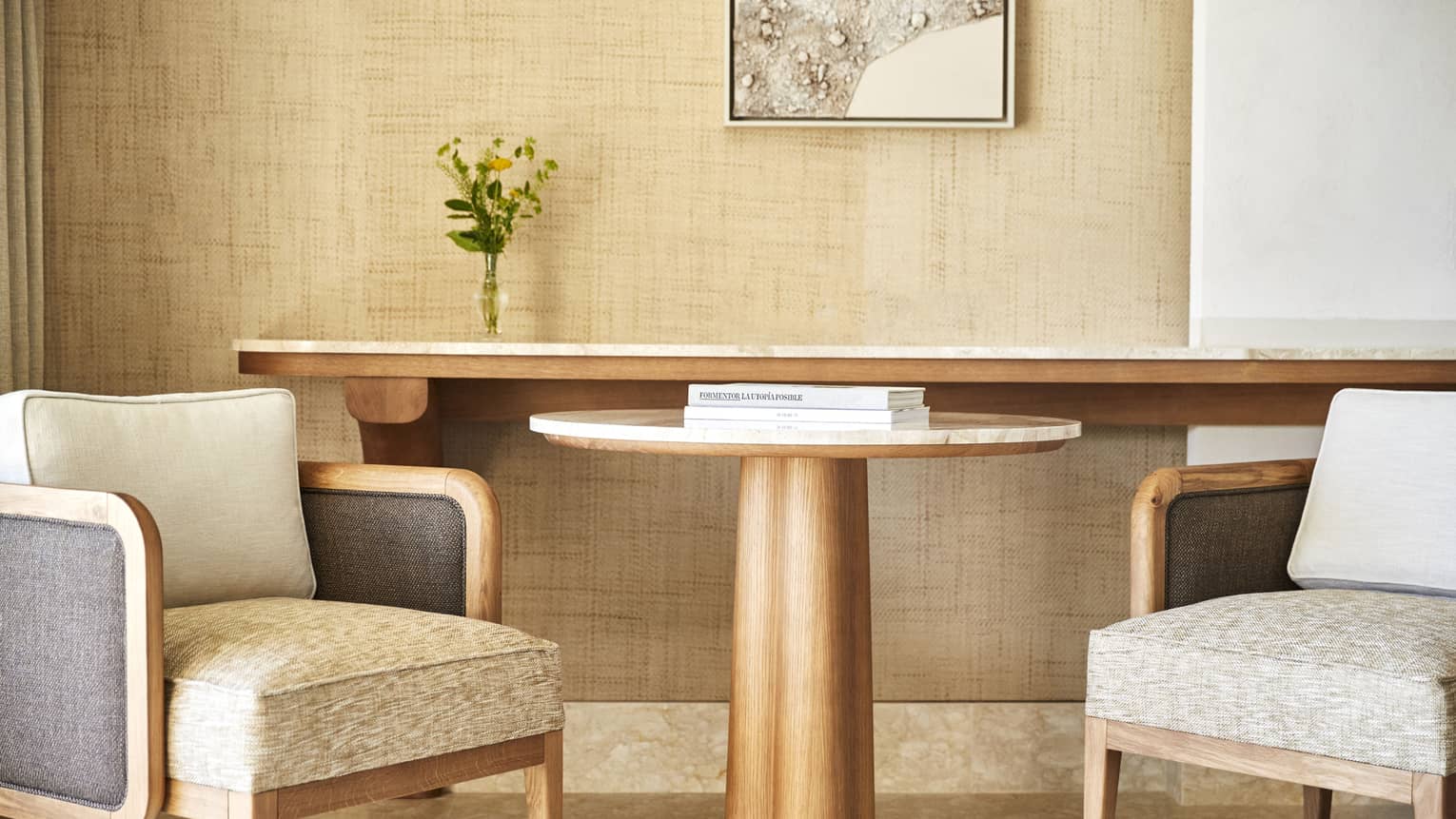 Round table with two chairs in a luxury resort guest room