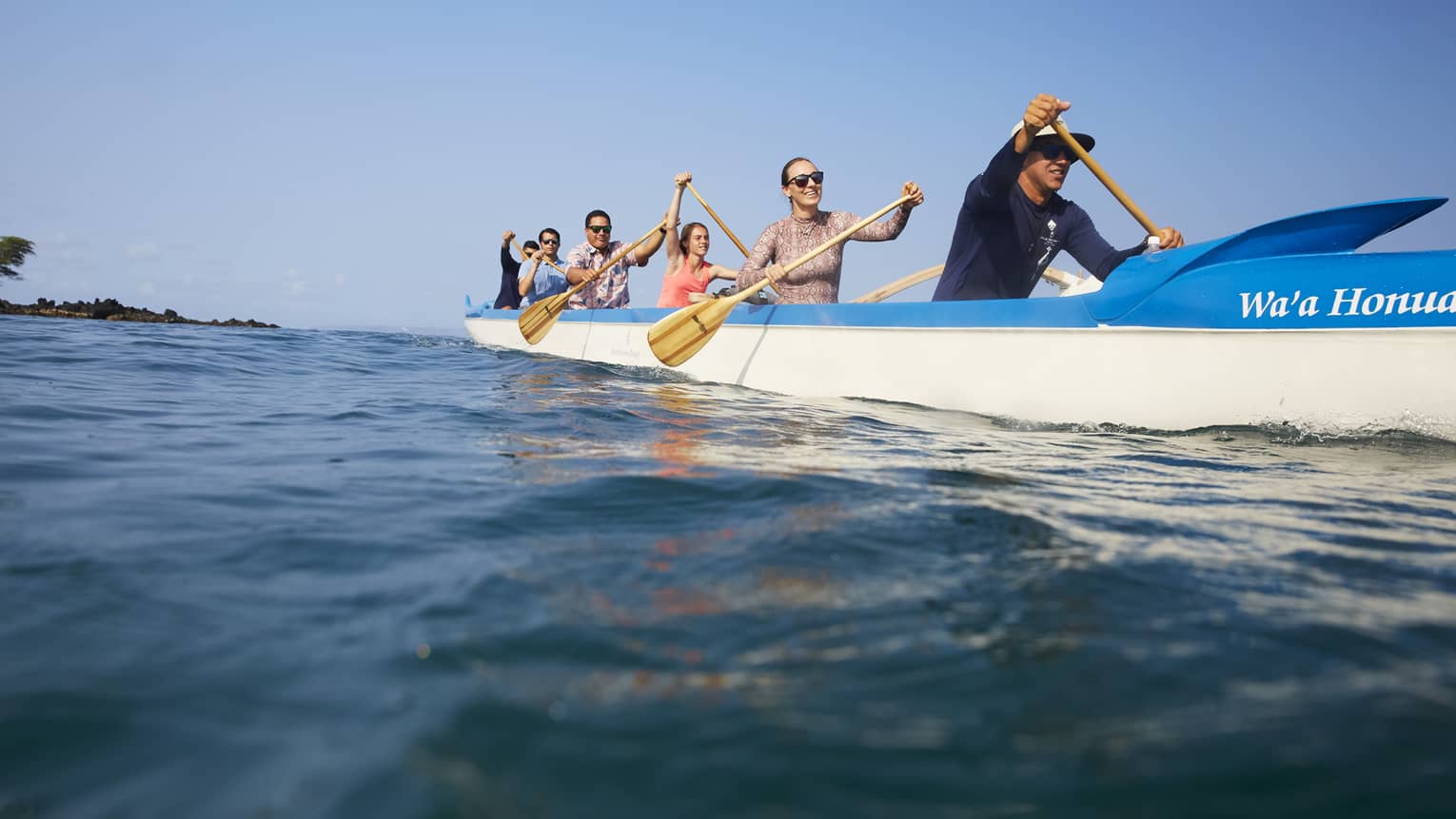 A group of guests kayaking on the ocean