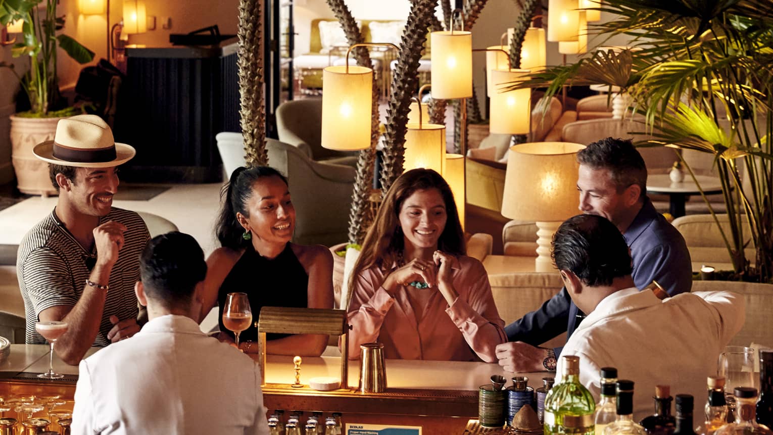 Family and friends sitting at a bar.