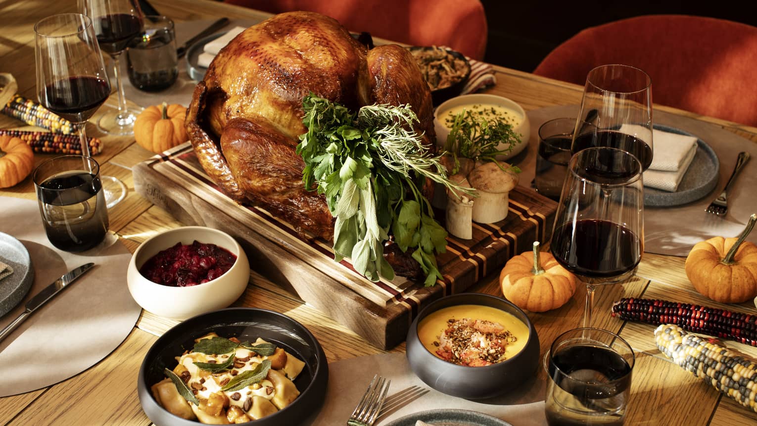 An assortment of autumn or Thanksgiving food, including turkey.