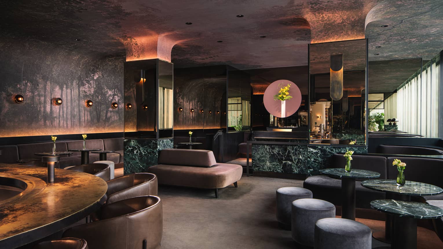 Interior of Marcus restaurant featuring wall-to-ceiling tree murals