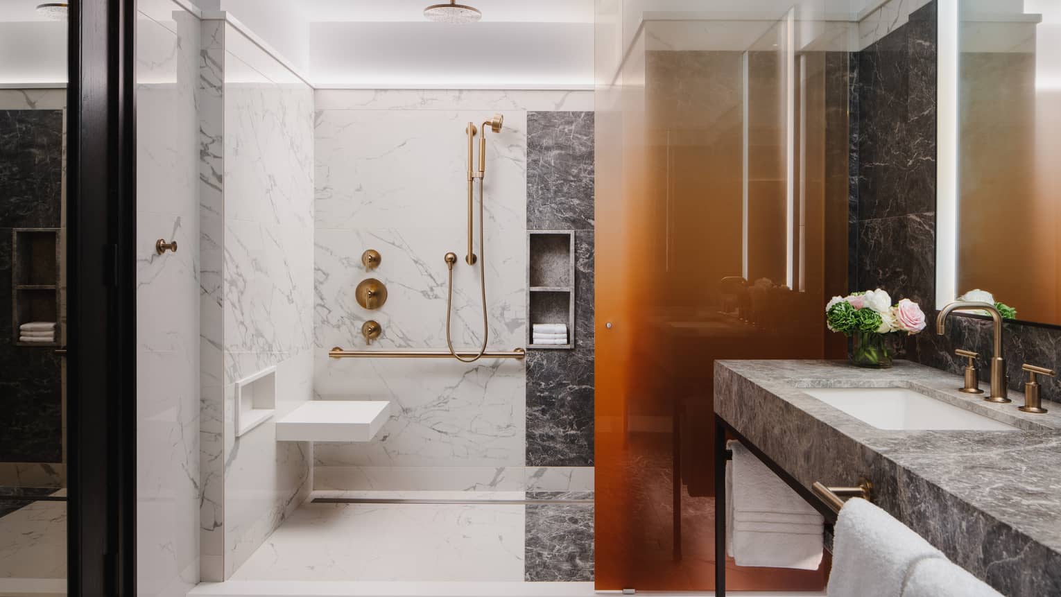 Marble bathroom with mobility-accessible shower