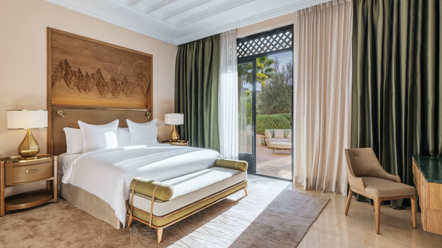 Hotel room with king bed and walk-out garden terrace
