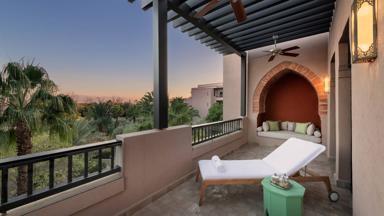 Marrakech hotel room terrace with lounge chair and garden view