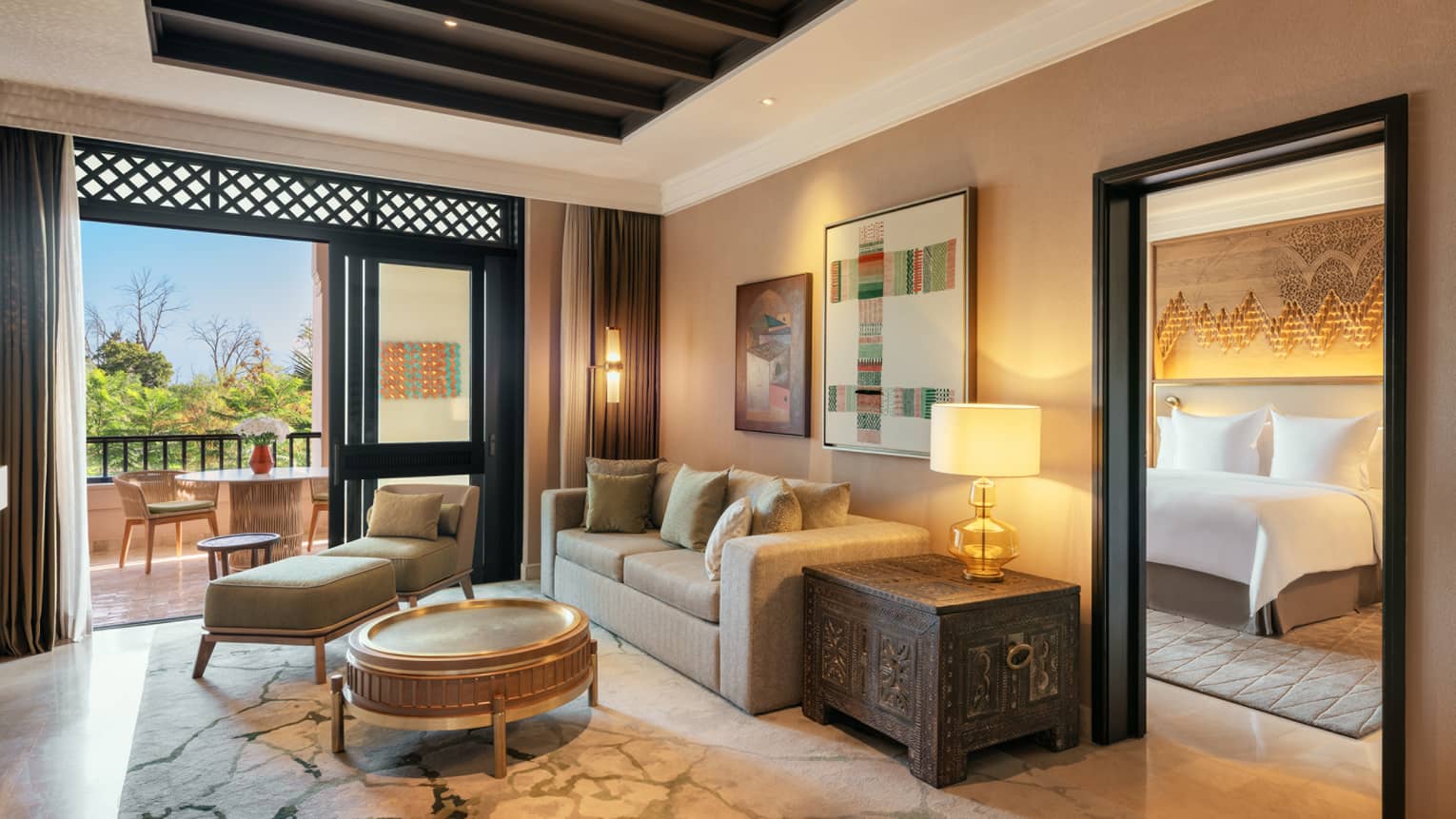 Marrakech hotel suite with living room and separate bedroom, pool view terrace
