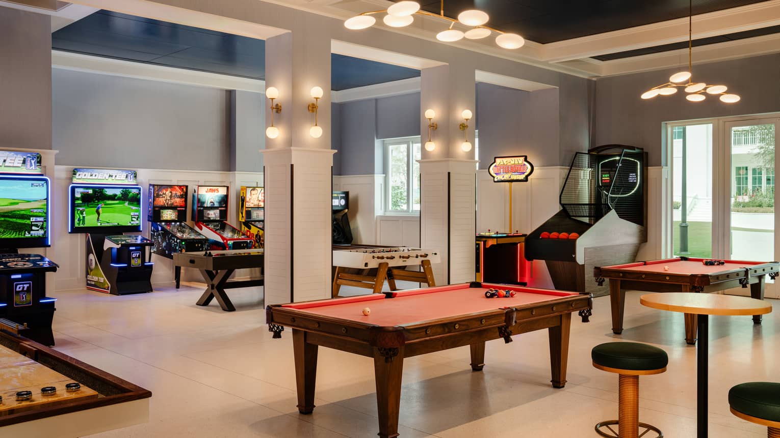 Game room with pool tables and arcade games