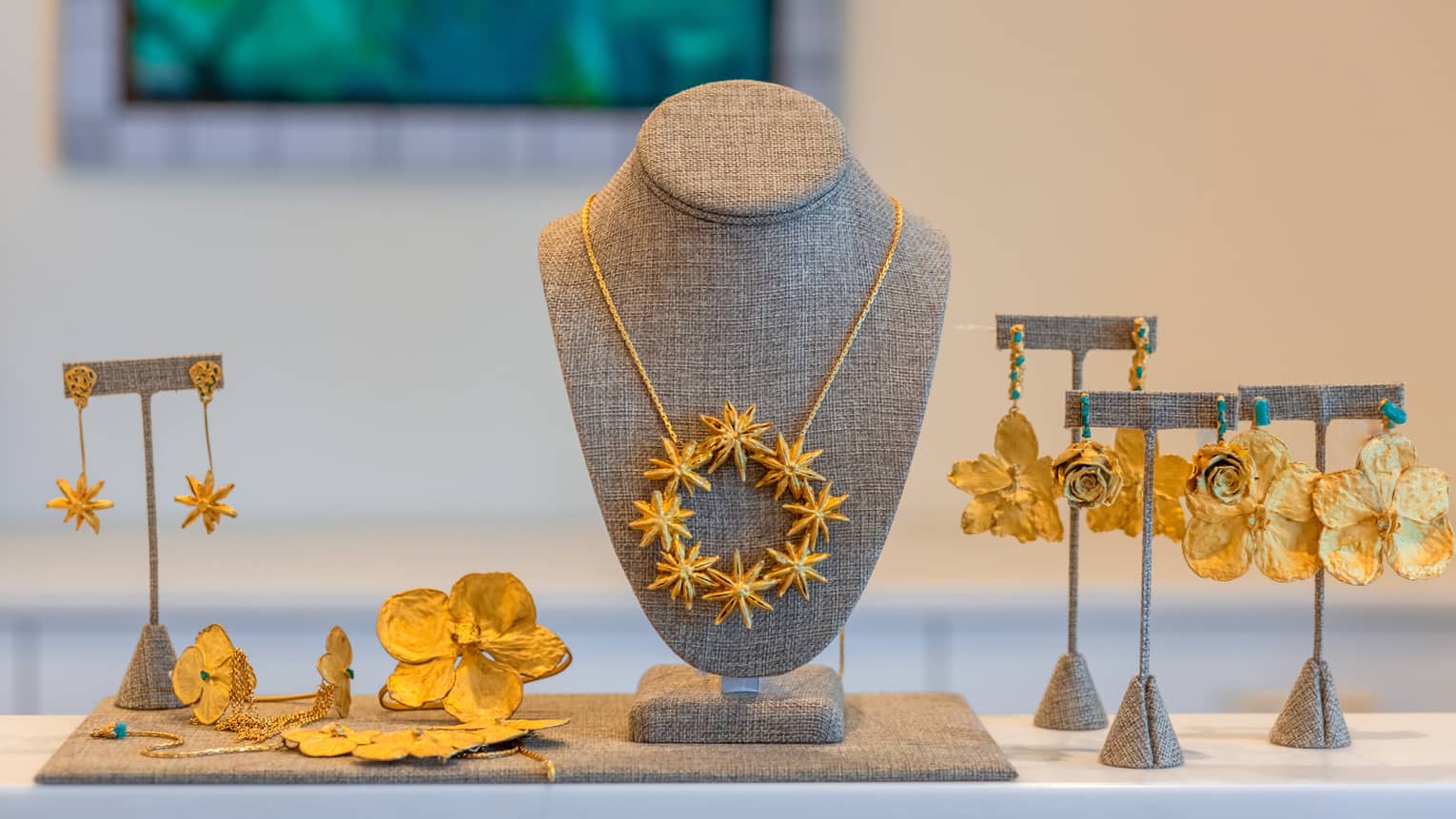 A display of gold necklaces and earrings