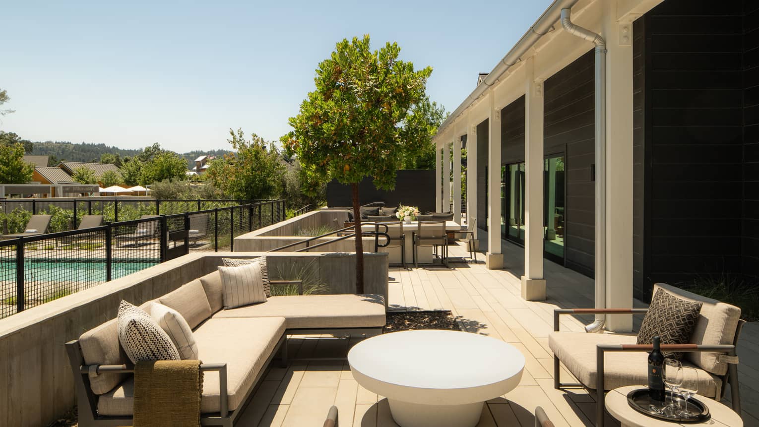 Large private patio of a luxury villa in wine country, featuring private pool