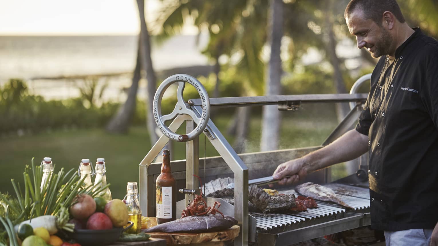 Executive Chef Richard Polhemus flips ribs, fish on outdoor barbecue grill