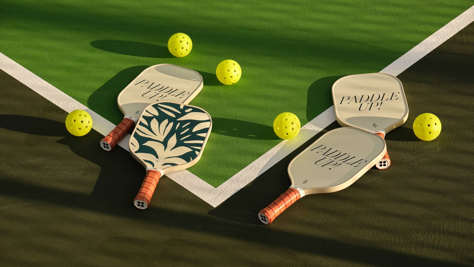 Pickleball paddles on a pickleball court