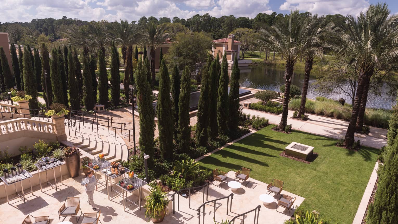 Aerial view of Sabal Terrace event space with dining patio, green lawn and rows of trees