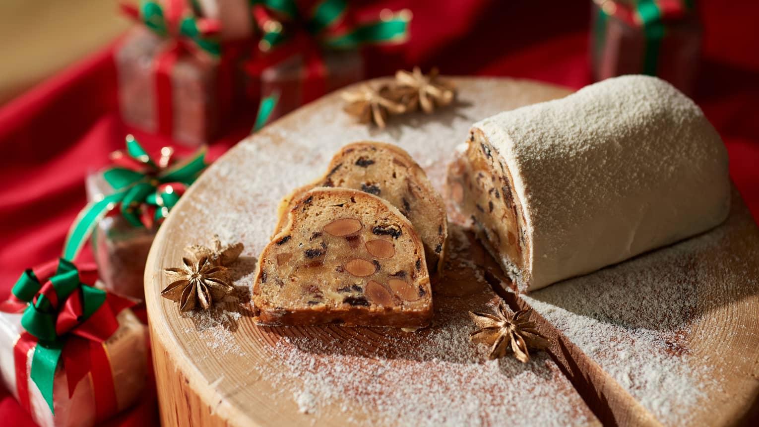 Stollen bread and a log surrounded by gifts.