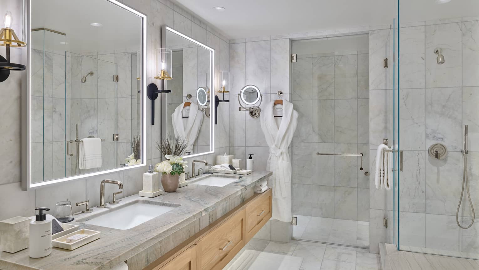 Marble bathroom with double vanity and walk-in shower