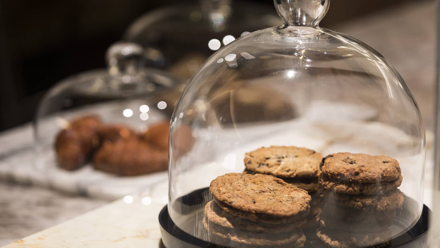 Cookies under a glass cover.
