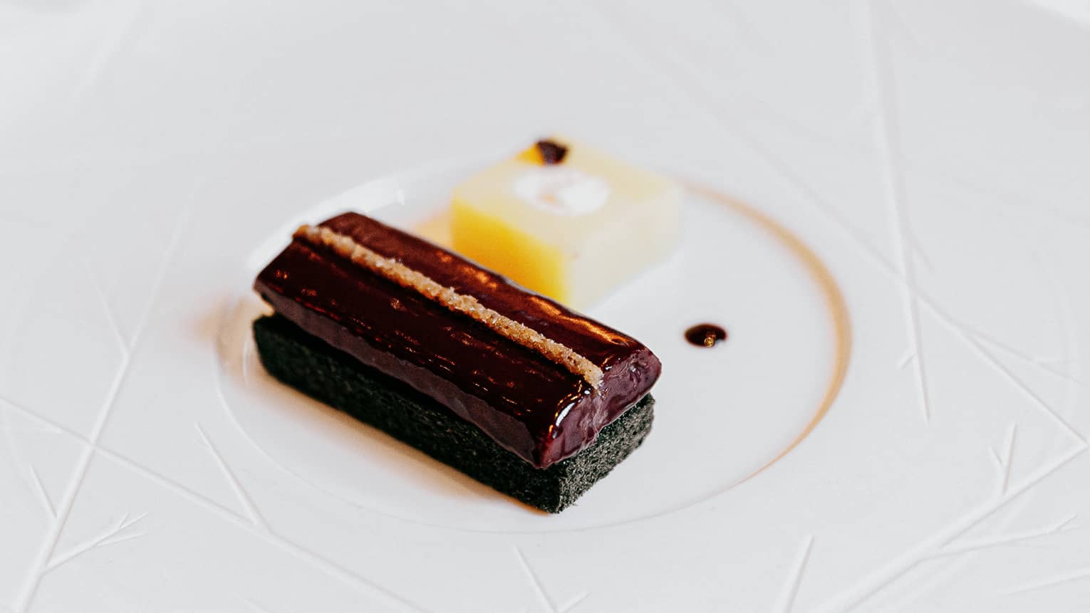 smoked eel from the somme, black bread, red wine reduction on