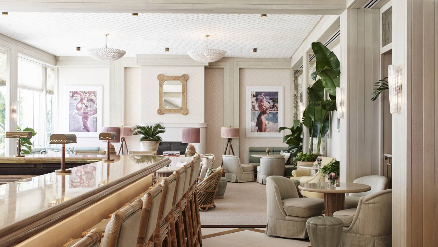 A seating area with plush chairs and round tables next to a wood bar.