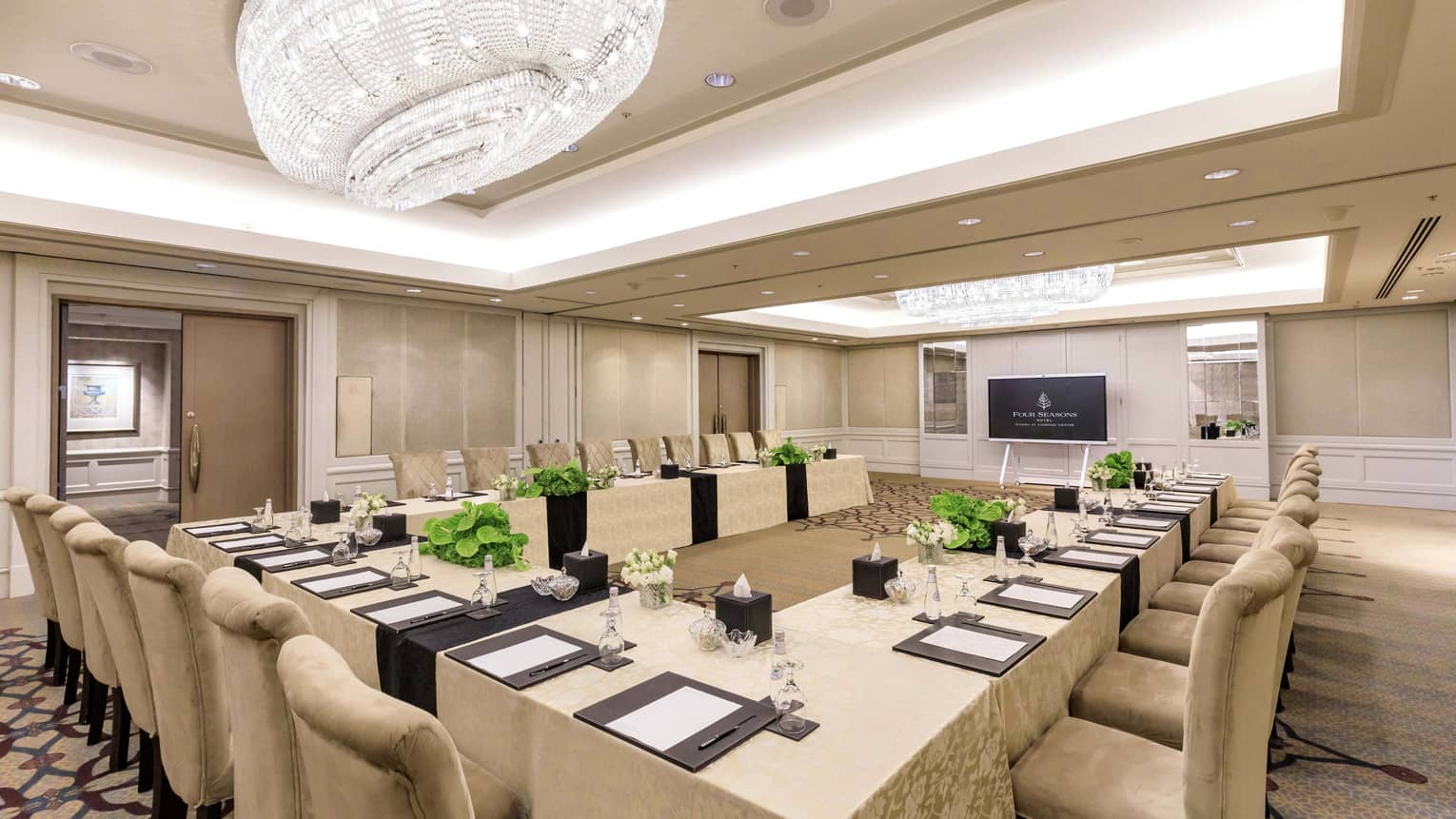Elegant meeting room with u-shape set up and crystal chandelier