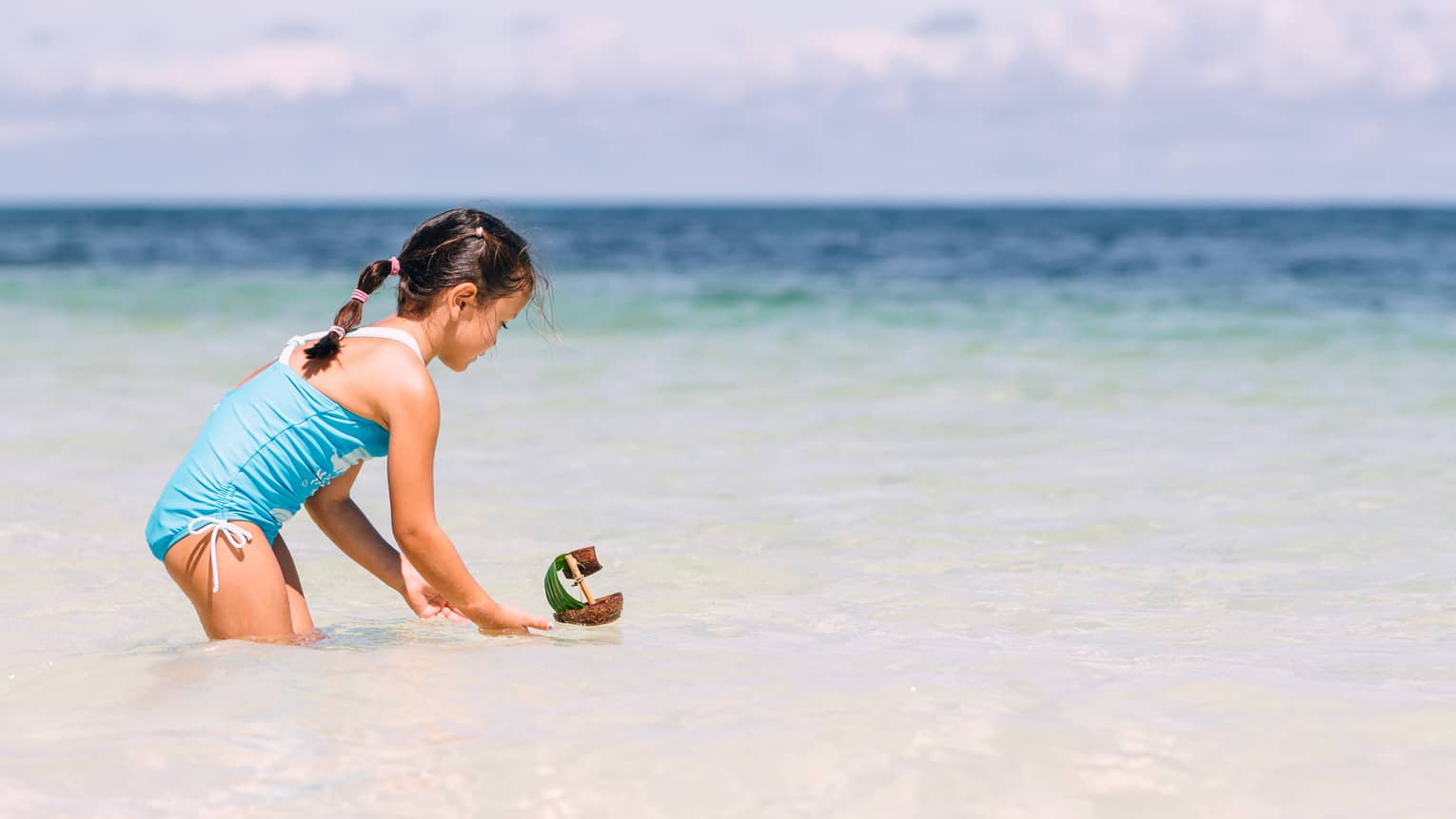 child swimming in the ocean
