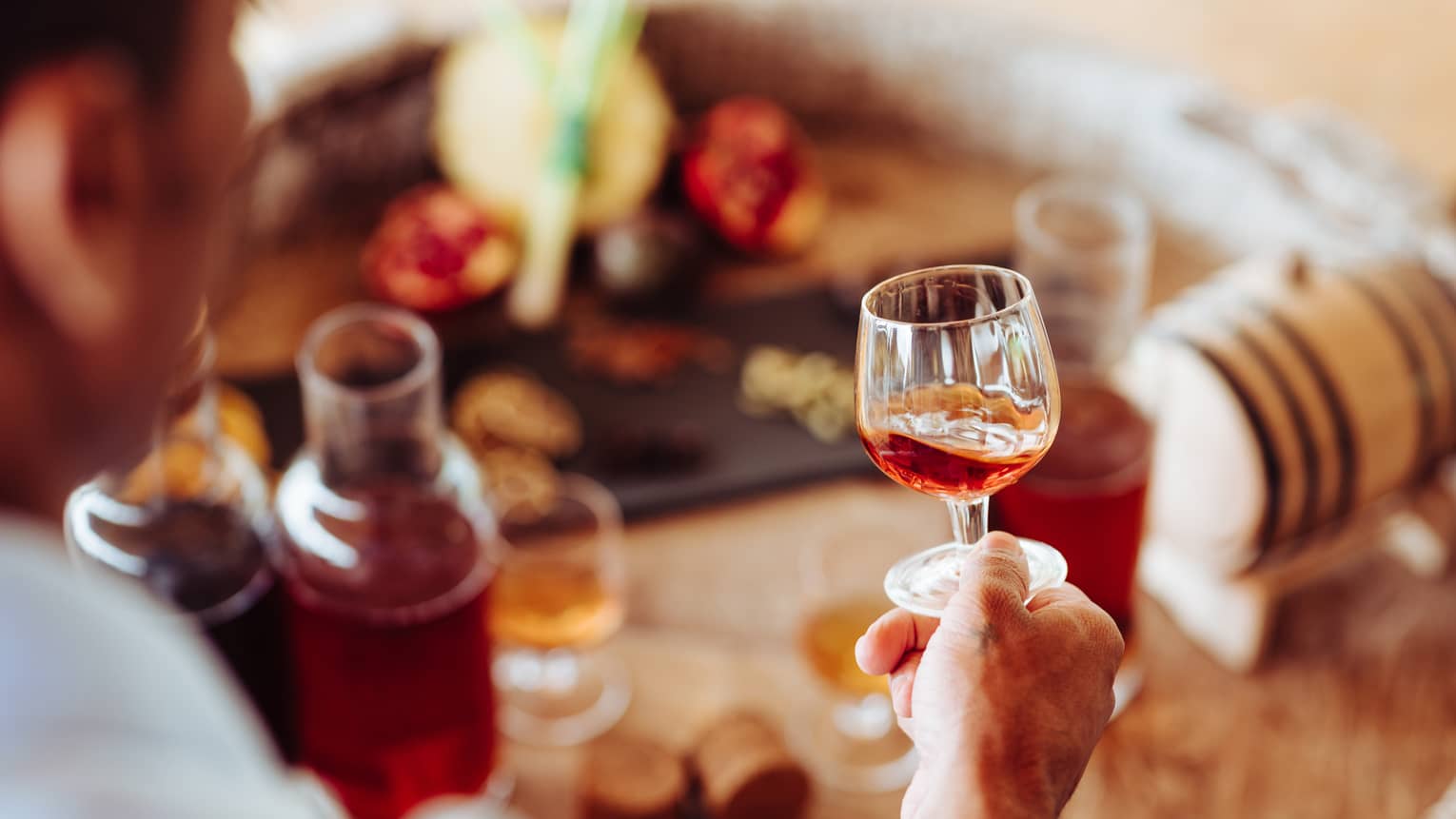Man holding a glass of rum. 