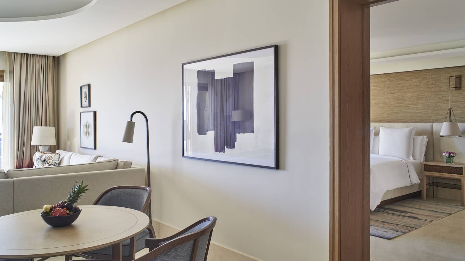 Hotel suite with separate bedroom and living-dining room