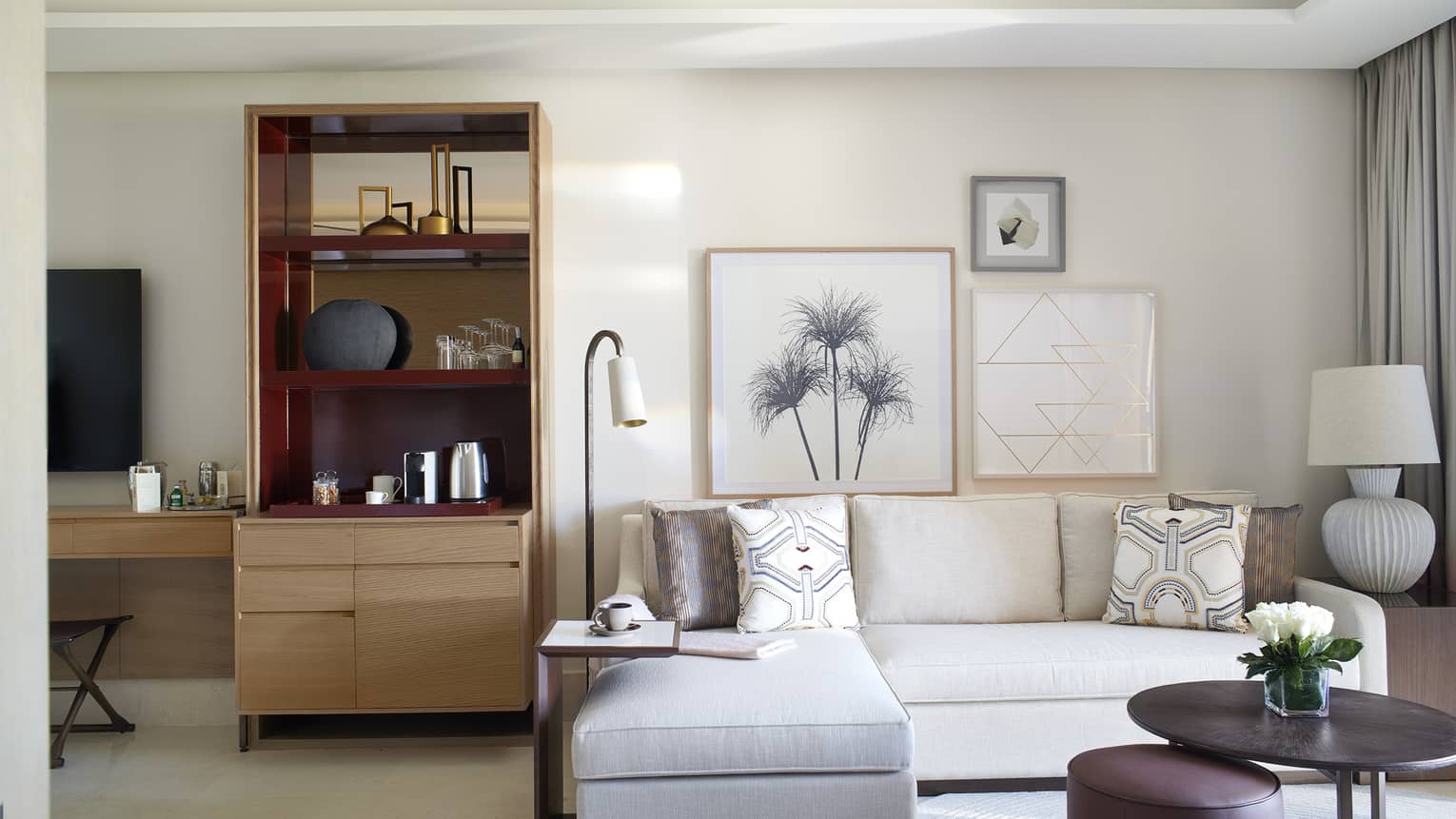 Sitting area with white sofa and wet bar area